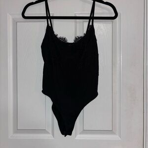 Small Black Silt Bodysuit with Black Lace Detailing on the top